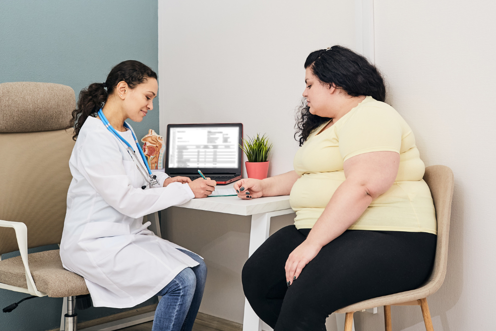 Overweight woman visiting doctor for advice.