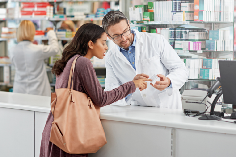 Woman speaking to pharmacist trying to buy over the counter melatonin
