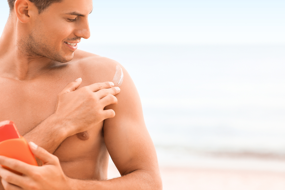 Man applying sunscreen to prevent eczema flare ups.